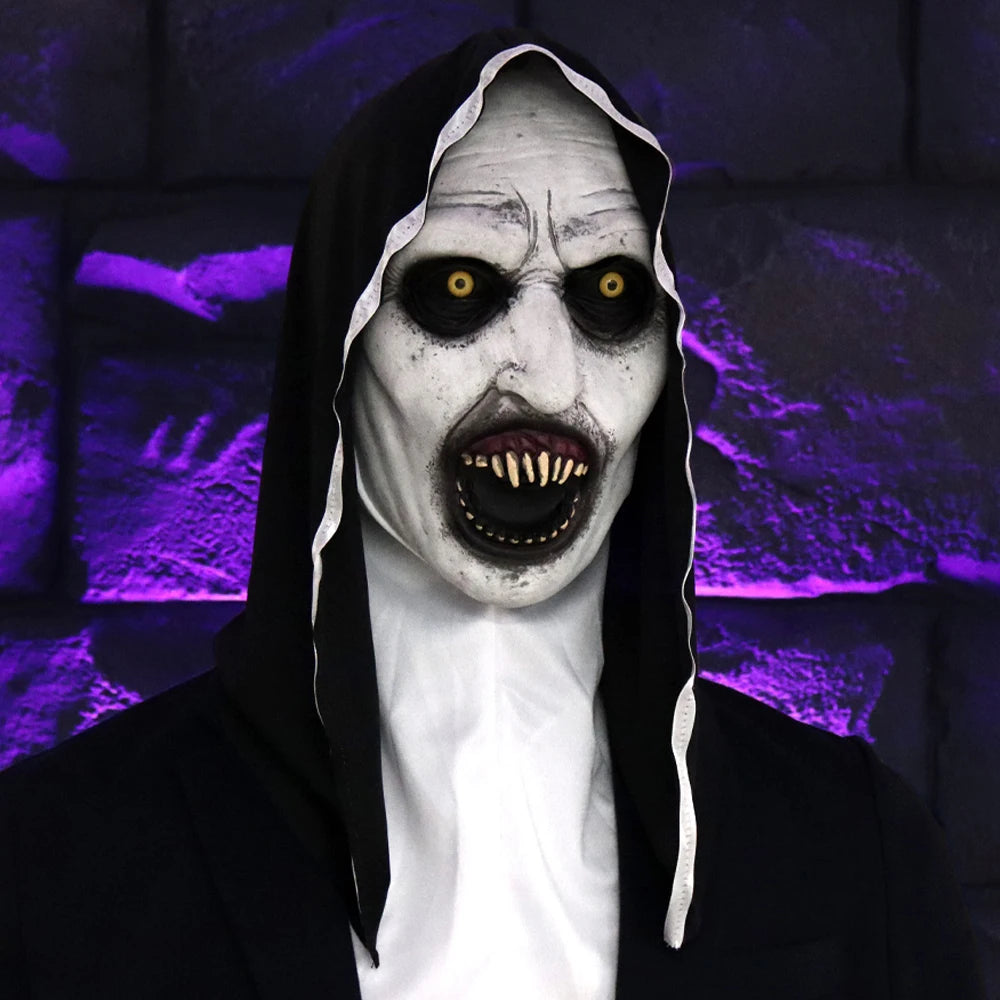 A realistic horror nun latex mask with pale white skin, dark eyes, and a black veil against a purple background.