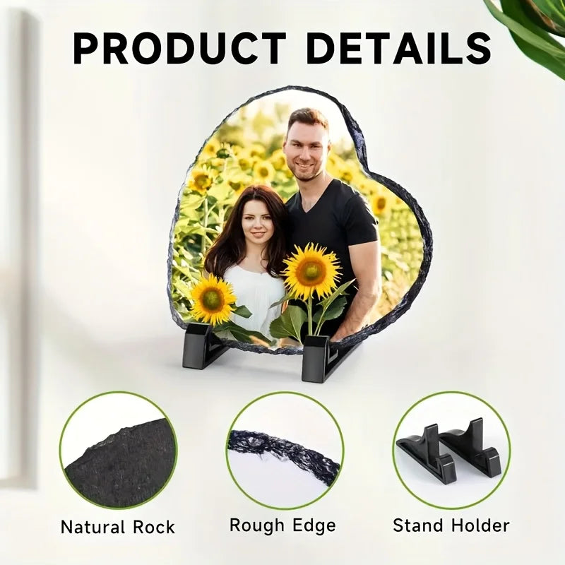 A man and woman are displayed in a heart-shaped slate photo frame with a stand, showing natural rock, rough edge, and stand h