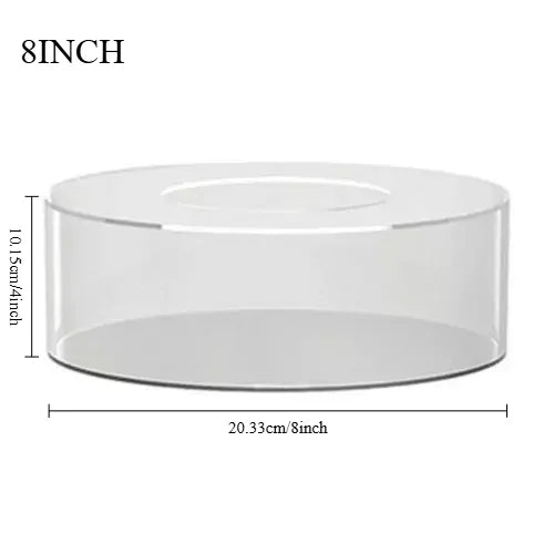 A clear acrylic cake display stand with an 8 inch diameter and a height of 10.15 cm.