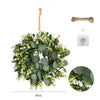 Artificial eucalyptus wreath with greenery and a wooden welcome sign