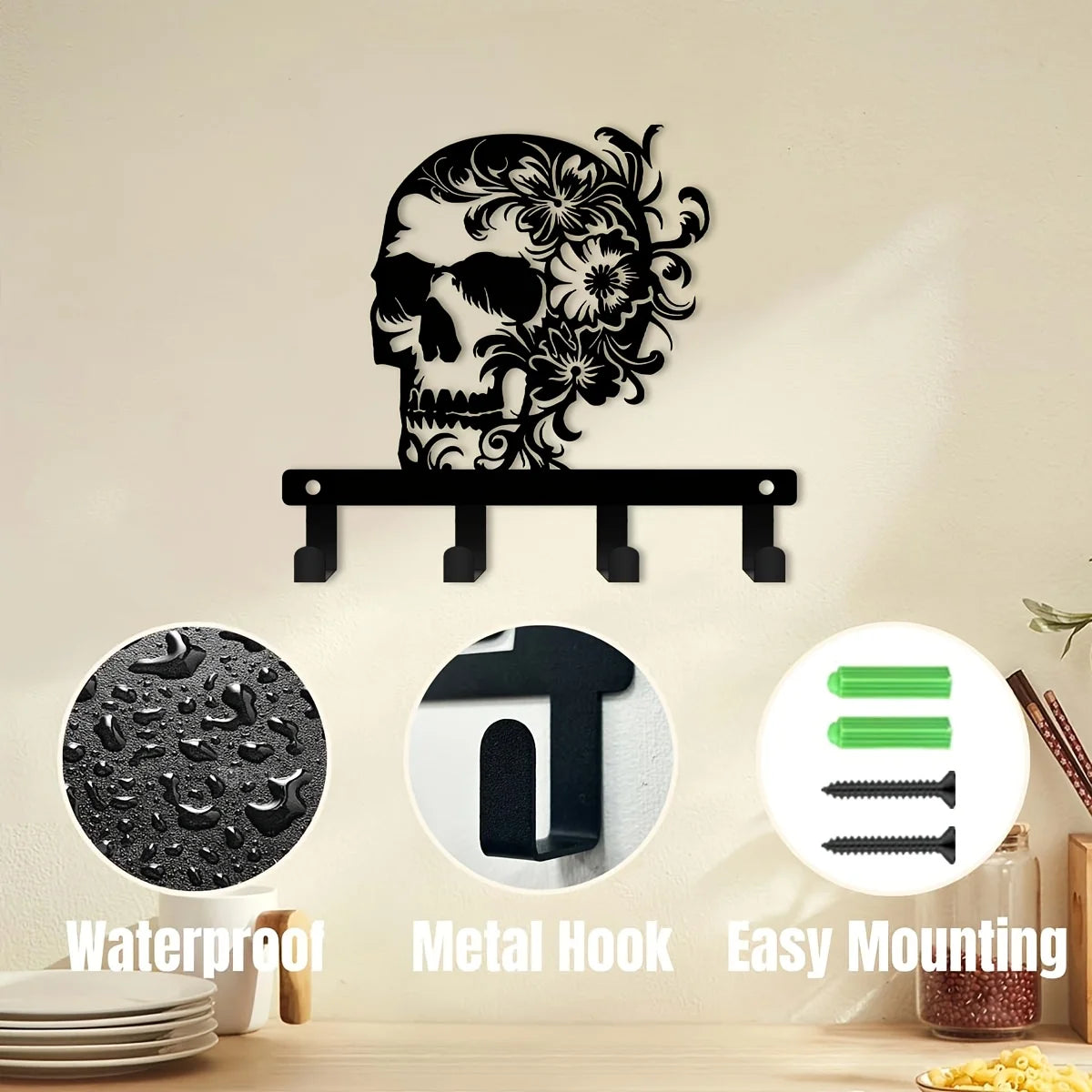 A black iron skull wall hook with a floral accent mounted on a white wall.