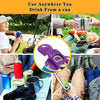A purple portable manual can opener is shown next to various canned and bottled drinks in an outdoor setting.
