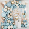 A blue and gold balloon garland arch featuring various sized balloons arranged in a tree shape for parties