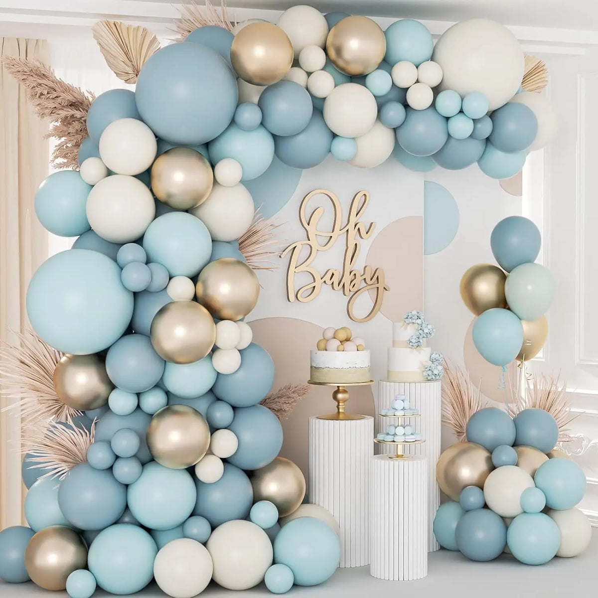 A blue and gold balloon garland arch featuring various sized balloons arranged in a tree shape for parties