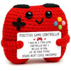 Handmade red crochet potato doll with a positive game controller theme and an inspirational card