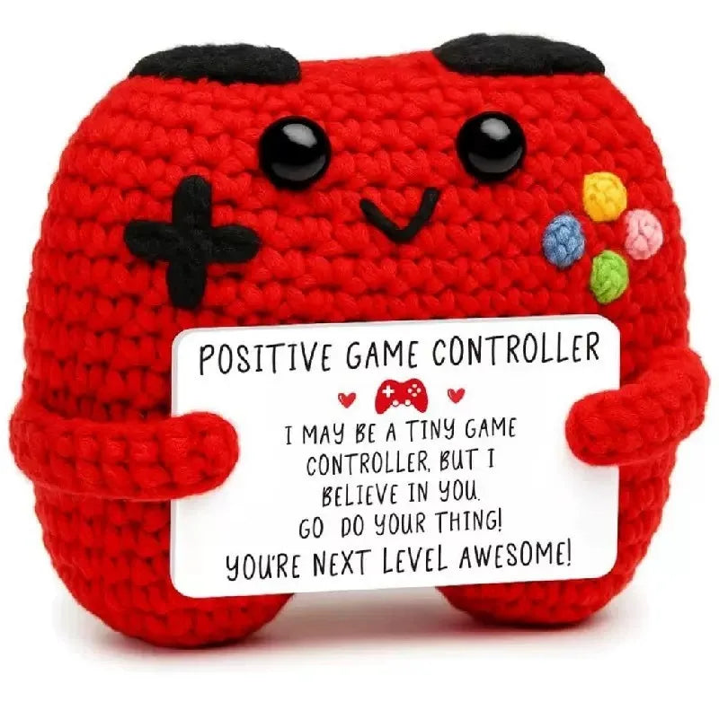 Handmade red crochet potato doll with a positive game controller theme and an inspirational card