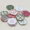 A set of eight heart-shaped fridge magnets featuring various plaid, polka dot, and patterned designs in green, pink, and whit