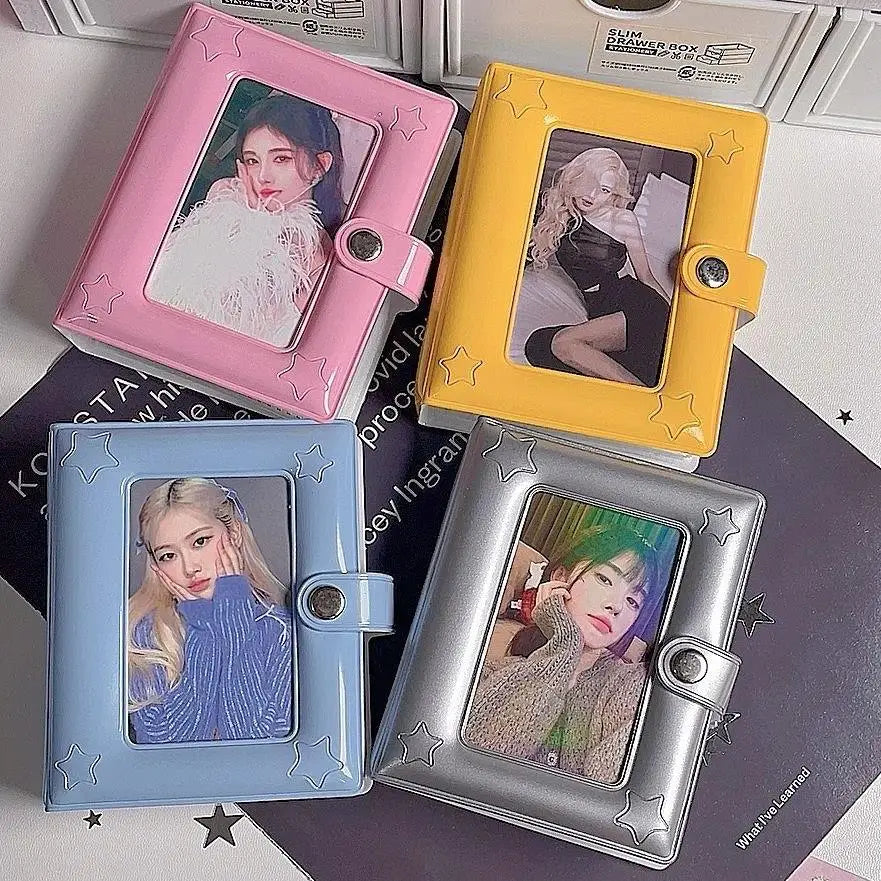 Three compact photo card holders in pink yellow and silver are displayed on a dark surface.
