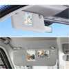 Three clear photo clips mounted on a car visor for interior decoration