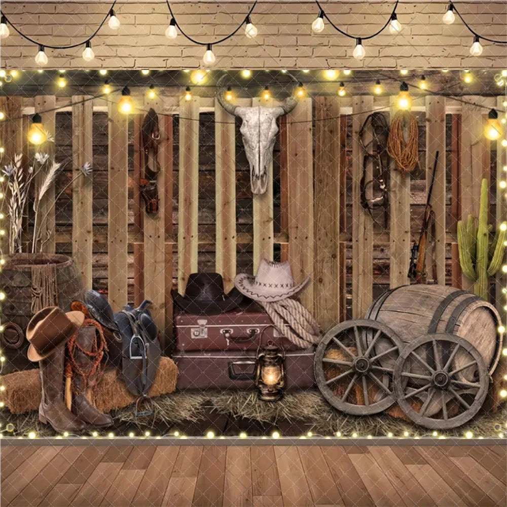 A rustic wild west cowboy birthday backdrop featuring wooden walls, leather goods, and antique barrels for a party scene.