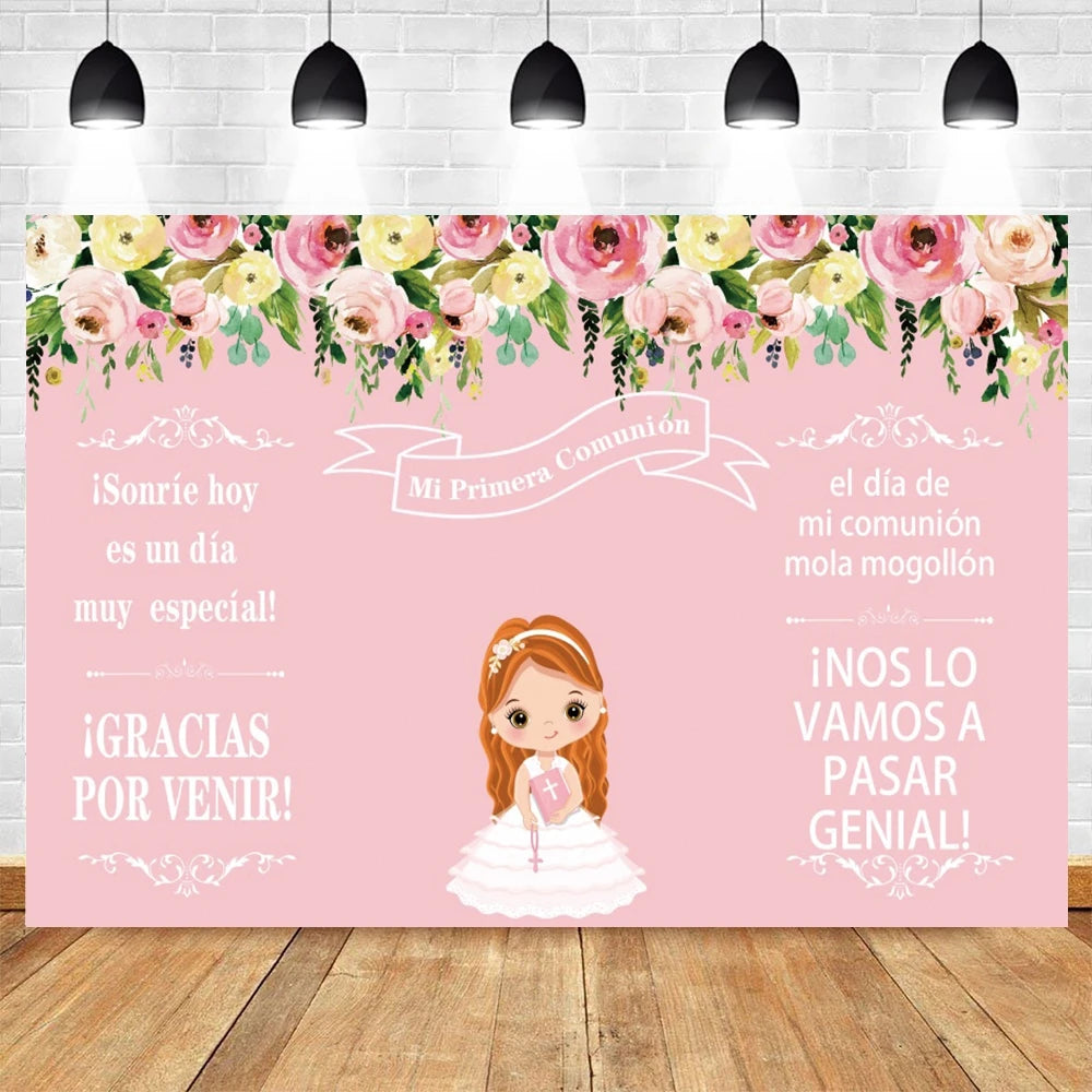 A pink and green floral backdrop for a First Communion celebration featuring a smiling girl