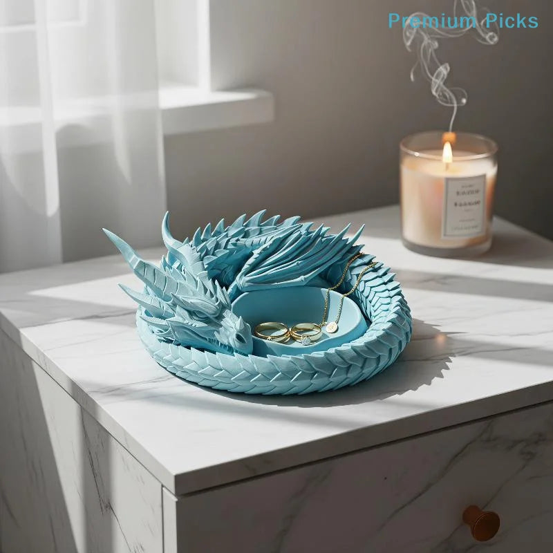 A light blue woven tray filled with gold jewelry and small items, set on a white marble surface.