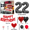 A set of red and black birthday balloons including a 22-inch number balloon, heart balloons, and solid colored balloons.