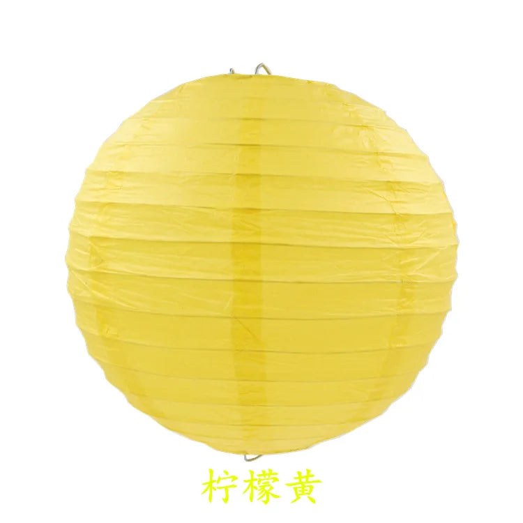 A round yellow paper lantern used for parties and weddings.
