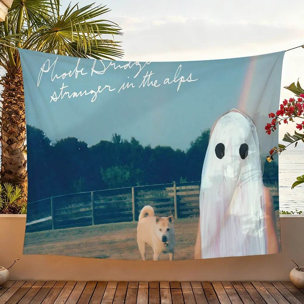 A tapestry featuring Phoebe Bridgers album art with a silhouette of a dog in an alpine landscape.
