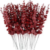 A bundle of deep red artificial eucalyptus leaves used for home and event decoration.