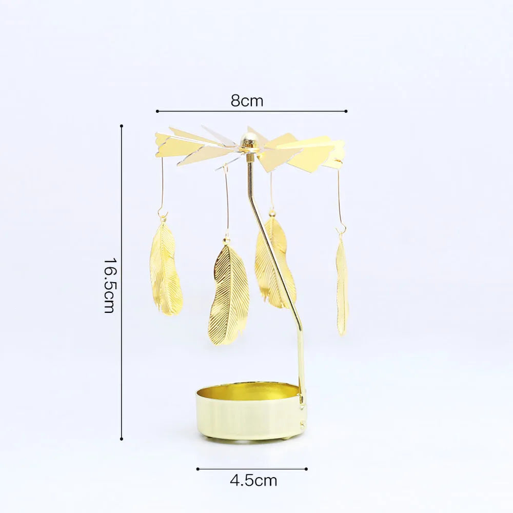 A gold rotating candle holder with a spinning carousel of feathers and a base.