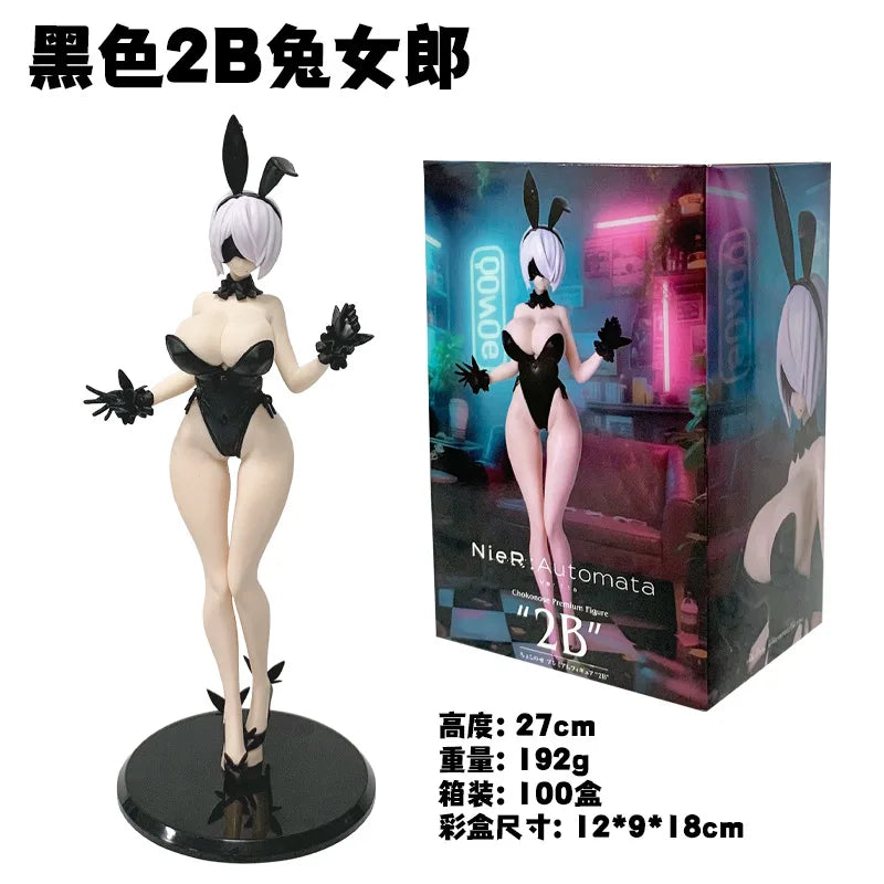A black 2B female figure collectible statue with white hair and black outfit displayed on a circular base.