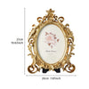 Vintage gold oval resin picture frame with a floral design and ornate detailing