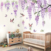 Wall decals featuring watercolor wisteria vines, birds, and butterflies decorating a nursery wall above a wooden crib.