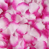 Pink and magenta artificial silk rose petals scattered on a white background.