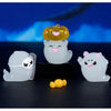 A set of seven cute luminous ghost resin ornaments, including a pumpkin and three white ghostly figures, displayed on a dark 