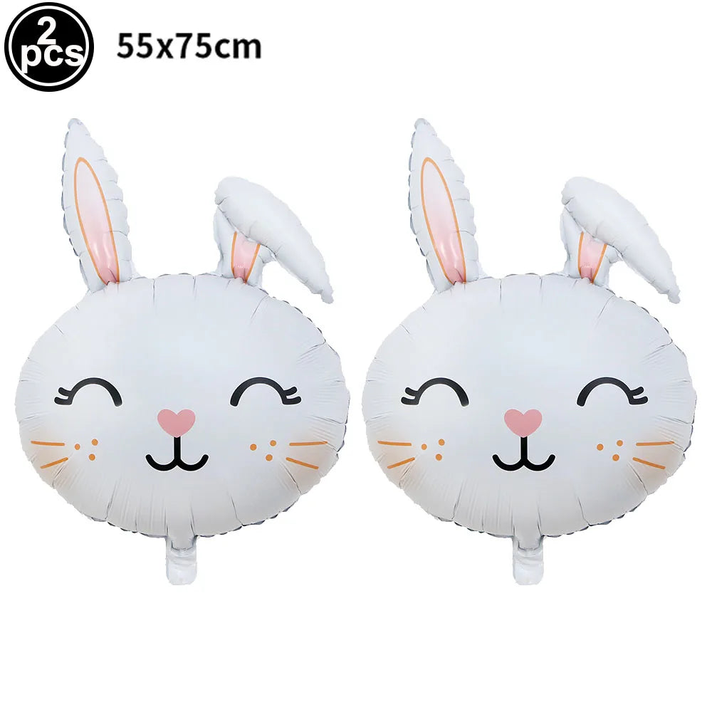A pair of white cartoon bunny foil balloons with long ears and cute facial features.