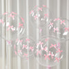 A set of clear latex balloons tied with pink ribbon bows, suitable for celebrations.