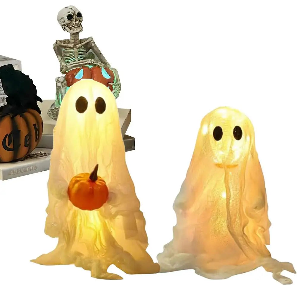 A set of lighted Halloween ghost decorations featuring a skeletal figure and a glowing translucent ghost.