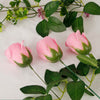 Pink artificial rose flower heads with green leaves used for DIY crafts and decor