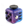 A purple fidget cube with black dots and a silver stud, used as a stress relief toy.
