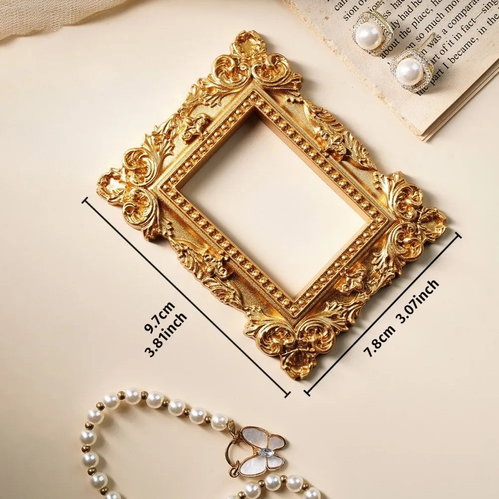 Vintage gold DIY shadow box frame with pearl accents displayed on a light background.