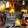 A collection of glowing LED candles in various sizes and colors arranged on a wooden box and near a fireplace.
