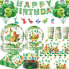 A collection of dinosaur birthday party supplies including a banner, balloons, and cake topper