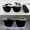 Black sunglasses with 'JUST MARRIED' text on the frame and illuminated borders