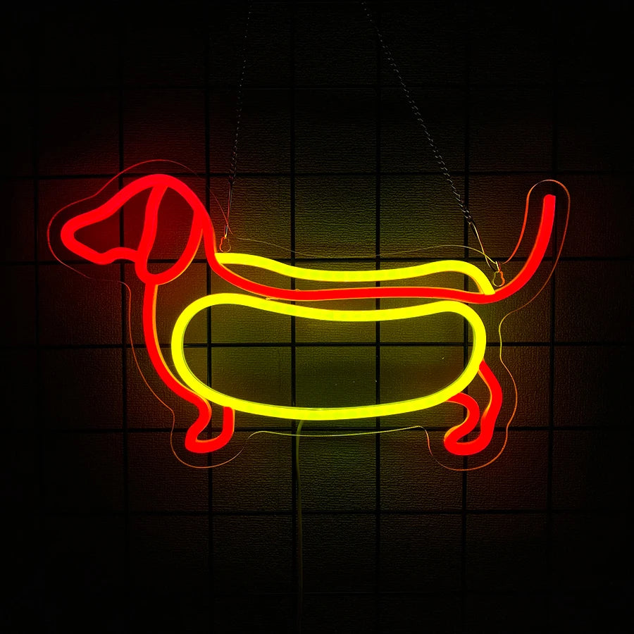 An illuminated neon sign shaped like a dachshund dog in red and yellow light against a dark background.