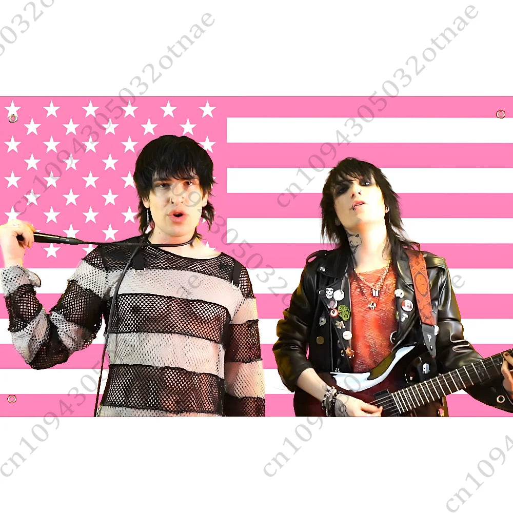 A woman with dark hair wearing a striped top stands against a pink and white striped flag background.