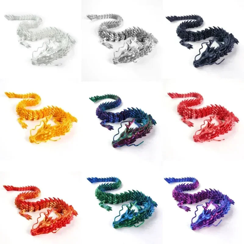 A collection of five 3D printed resin dragon ornaments in silver, black, yellow, green, and red colors.