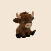 A small, brown statue of a Highland cow with horns and dark eyes.