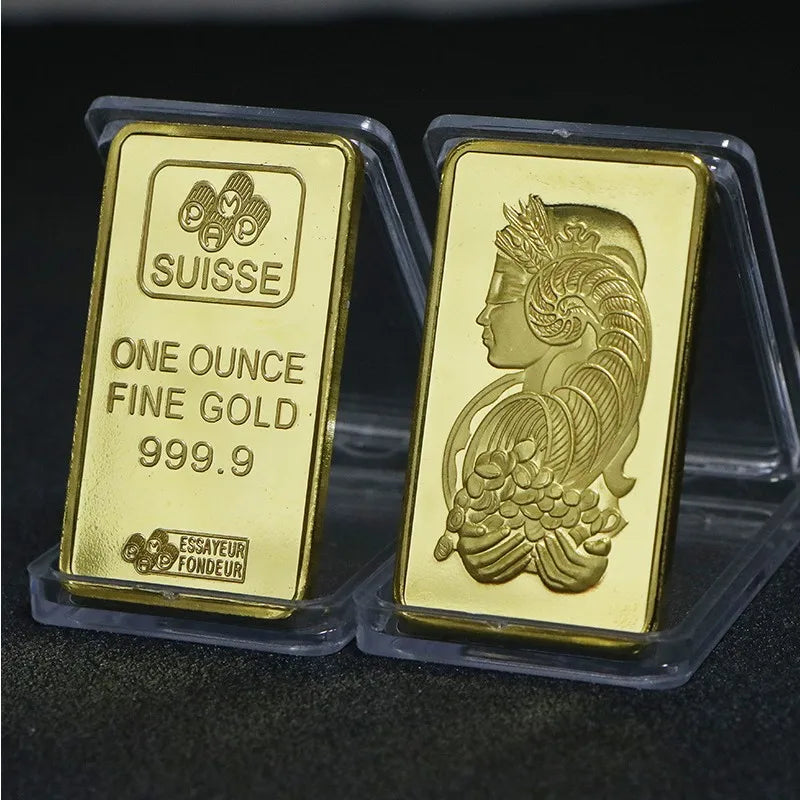 A gold-colored bullion ingot labeled SUISSE ONE OUNCE FINE GOLD 999.9 in a clear plastic holder.
