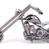 A handcrafted metal motorcycle model featuring chrome detailing and vintage styling.