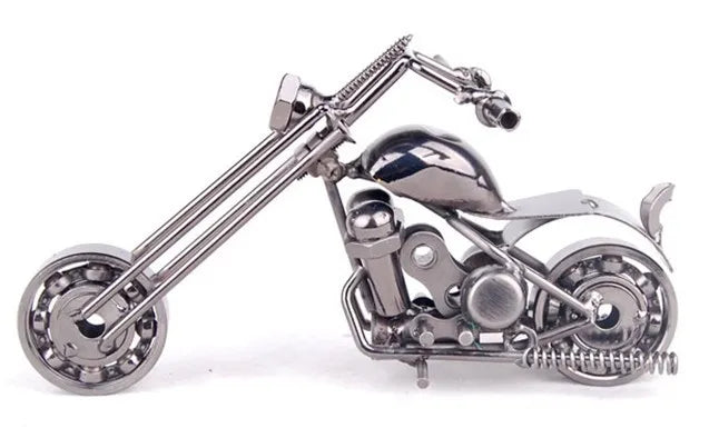 A handcrafted metal motorcycle model featuring chrome detailing and vintage styling.