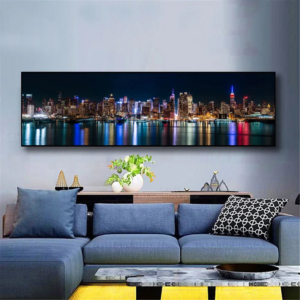A canvas print depicting the New York City skyline at night with city lights reflecting on water.