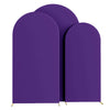 Three purple spandex fitted wedding arch covers standing upright.