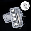 Clear plastic container holding reusable stainless steel ice cubes and a mold