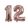 Two rose gold foil number balloons shaped like 1 and 2 for birthday party decor