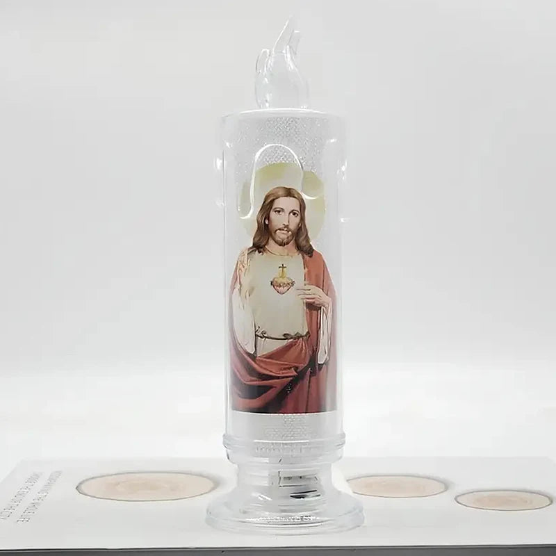 A clear glass flameless LED prayer candle featuring an image of Jesus Christ.
