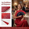 A woman in a red gown holds an elegant red and black bamboo folding fan.