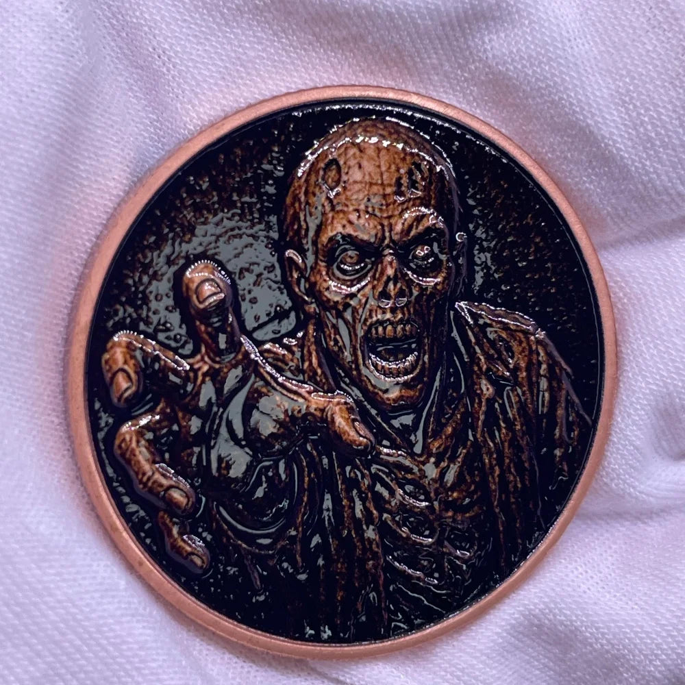 A dark copper challenge coin featuring a grim reaper design.