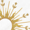 A gold celestial halo headband featuring sun rays and crescent moon and star accents.